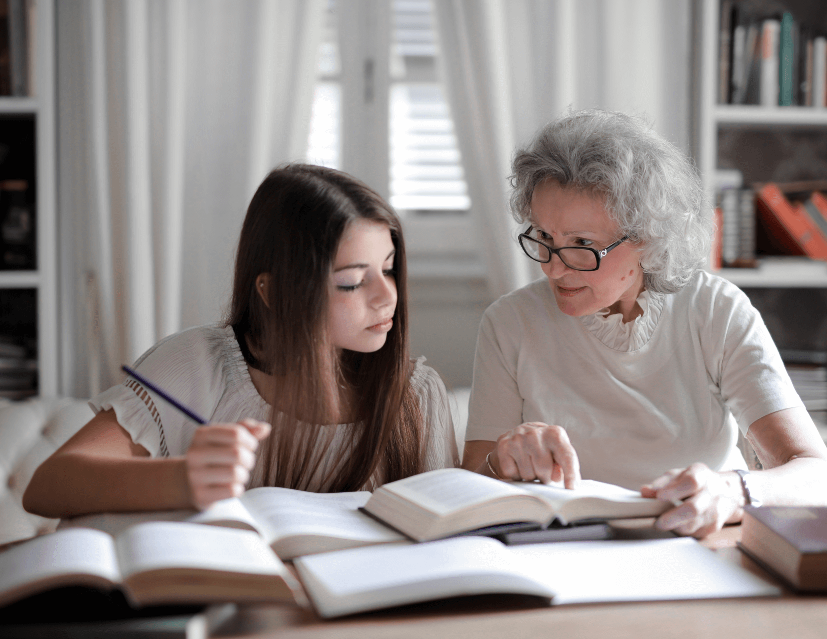 Grandmother helping child with schoolwork